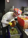 mixing the magic kimchi sauce into the cabbage & radish